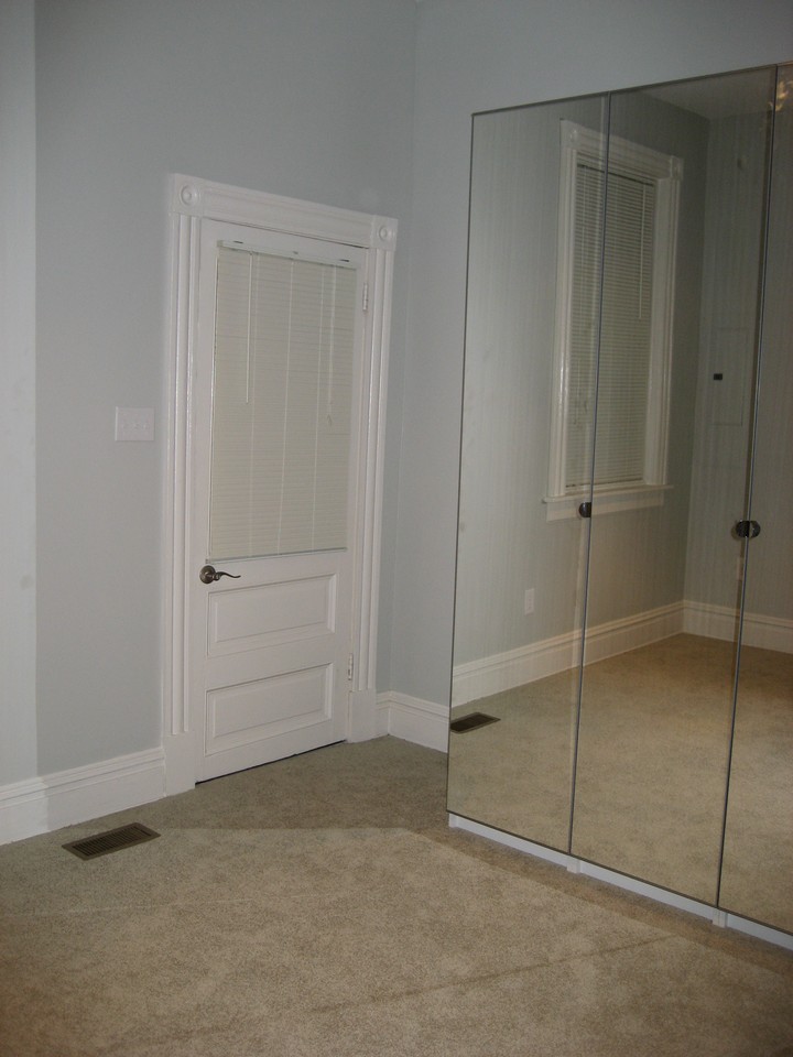 bedroom with access to fenced back yard